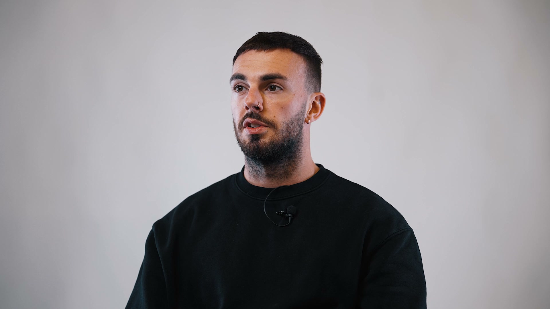 Hair transplant patient discussing his experience at follow-up