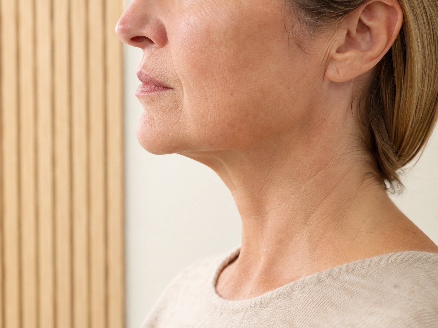 Close side view showing natural jawline, chin and neck proportions